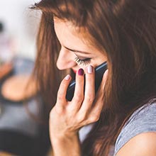 Image of of woman on the phone.